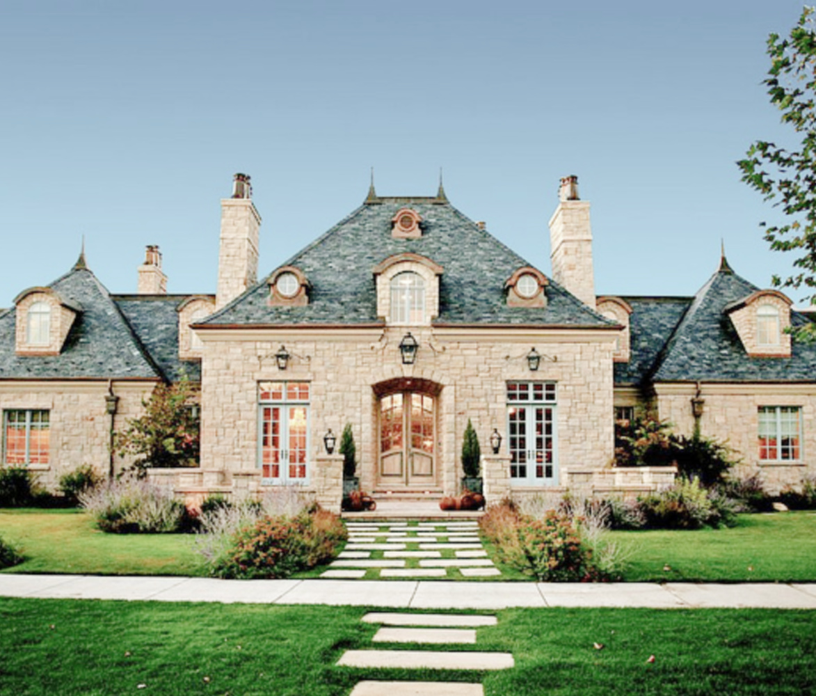 Breathtaking stone exterior of a French and Gustavian inspired Utah cottage - Desiree Ashworth of Decor de Provence and Beljar Home. #frenchcottage #houseexteriors