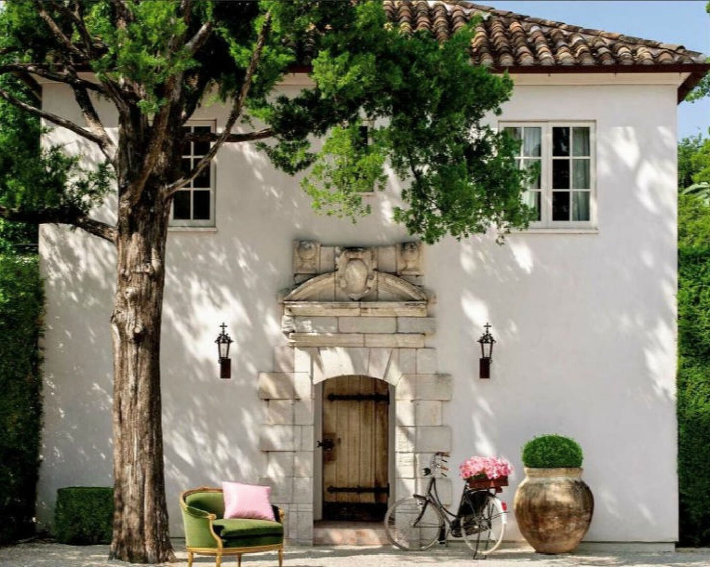 Gorgeous white stucco French farmhouse inspired house exterior with tile roof - Reagan Andre. #pamelapierce #reaganandre #frenchfarmhouse #houseexterior #housedesign #whitestucco