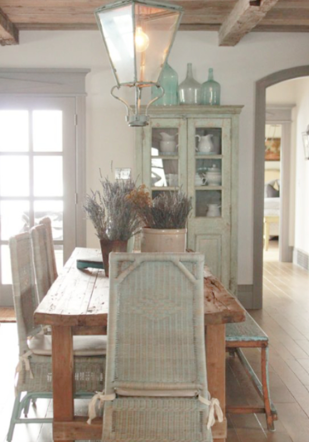 Soft greens and greys in the French country dining room of a Utah cottage by Desiree Ashworth of Beljar Home.