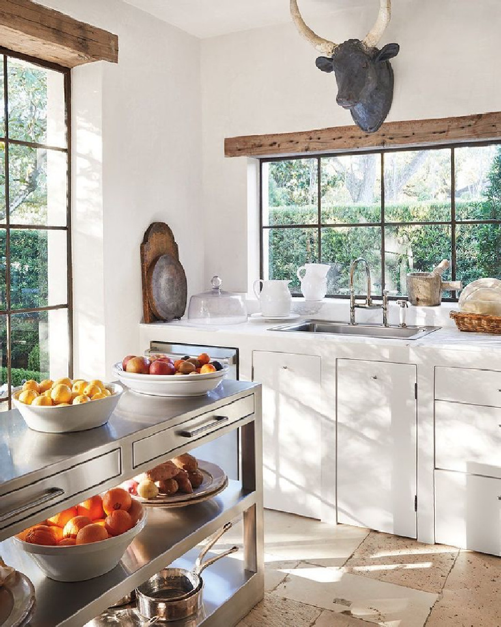 French country white kitchen designed by Pamela Pierce - photo by Miguel Flores Vianna. #frenchkitchen #frenchcountry #kitchendesign #oldworld #pamelapierce #modernfrench