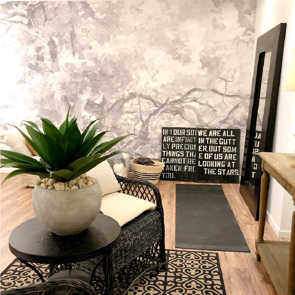 Grey and white trees in this wallpaper mural impart a calm, Scandi, modern look to an otherwise boring bonus room in our basement - Hello Lovely Studio. #wallpapermural #grisaille #trees #greyandwhite #accentwall