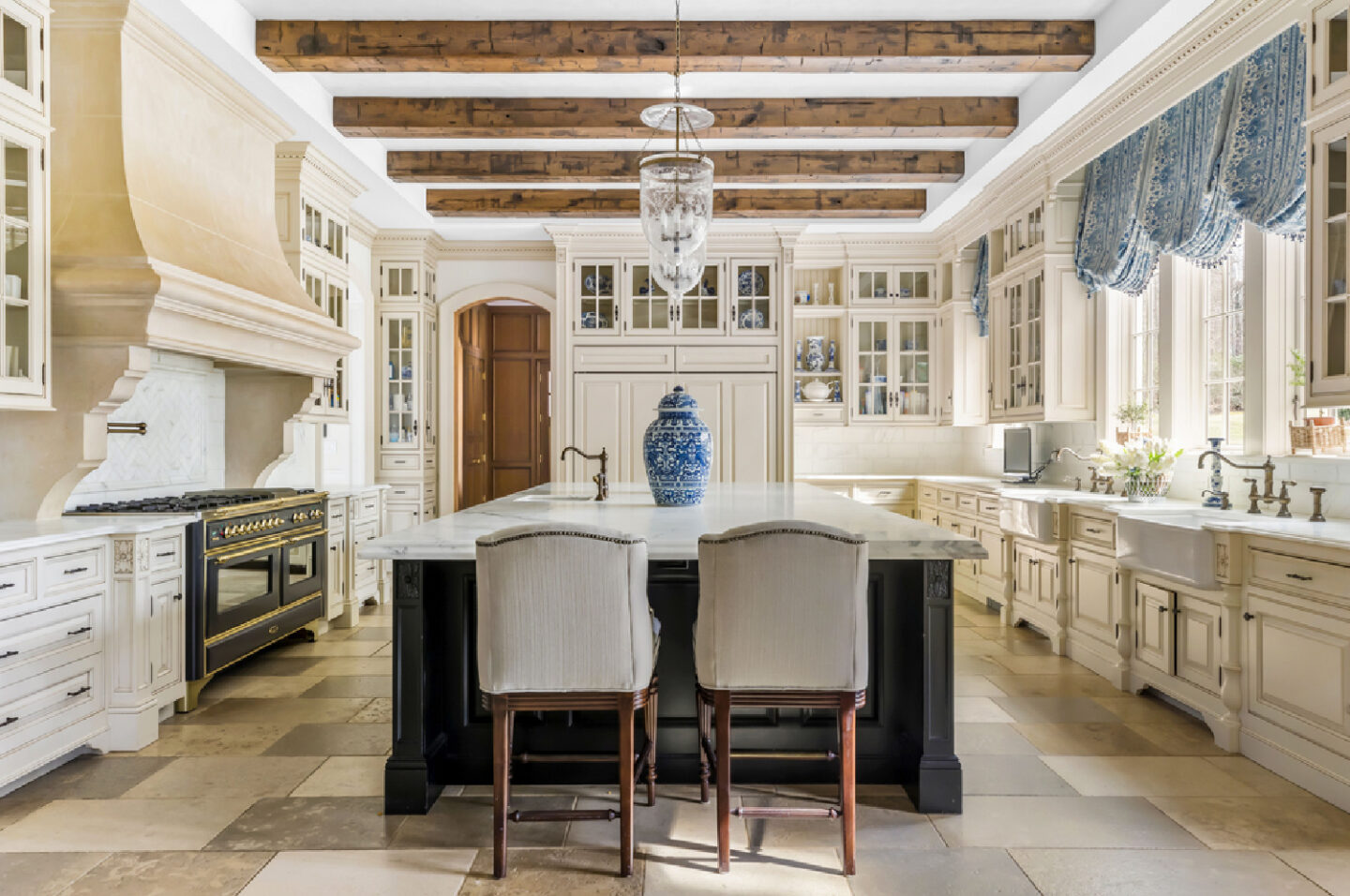 Magnificent traditional French country kitchen with blue and white accents - The Enchanted Home. #frenchkitchen #frenchcountrykitchen