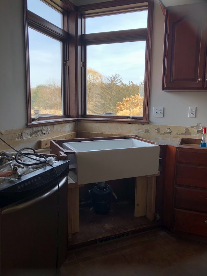 Farm sink being installed in our kitchen renovation - Hello Lovely Studio. #farmsink #fireclaysink