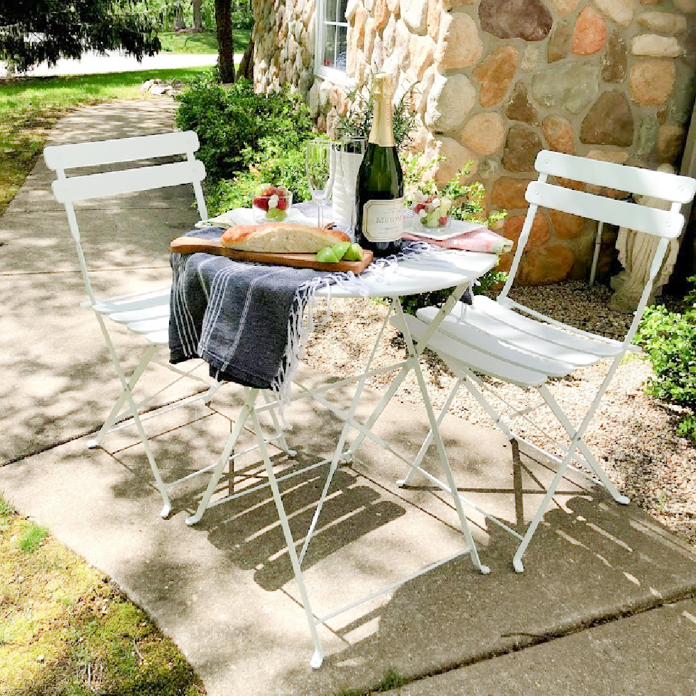 White Parisian style cafe dining set is perfect for small spaces and casual dining when you love a little romance - Hello Lovely.