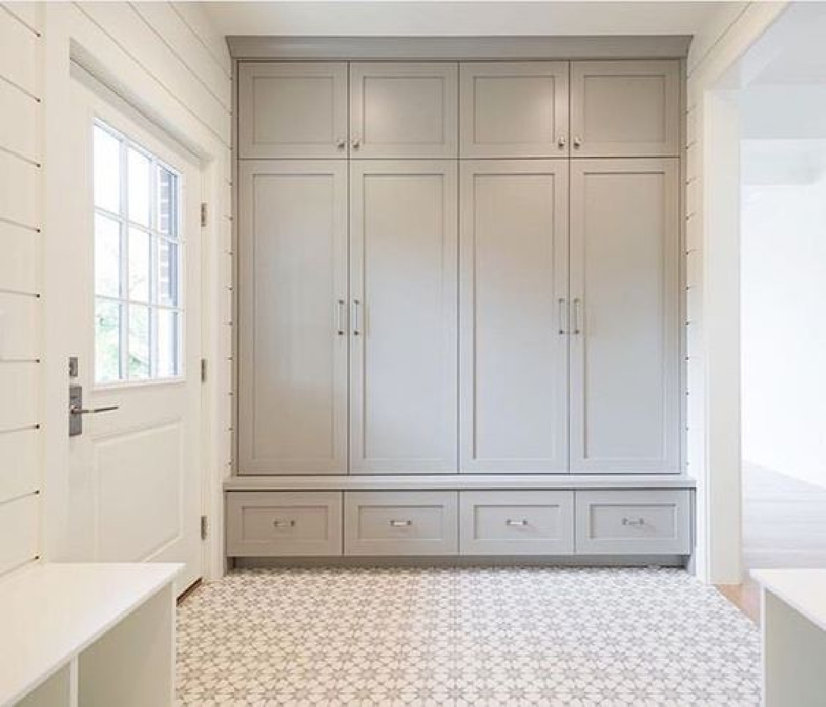 Breathtaking mud room with light grey built-in cabinets, shiplap walls and encaustic tile floors - Bria Hammel.