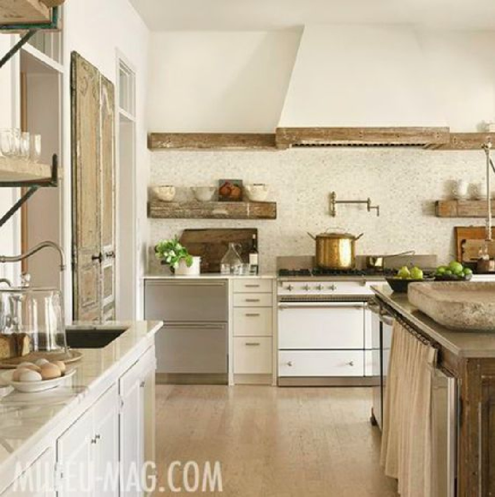 Shannon Bowers designed elegant rustic French kitchen with white range - Milieu magazine. #rustickitchens #frenchkitchen #frenchfarmhouse