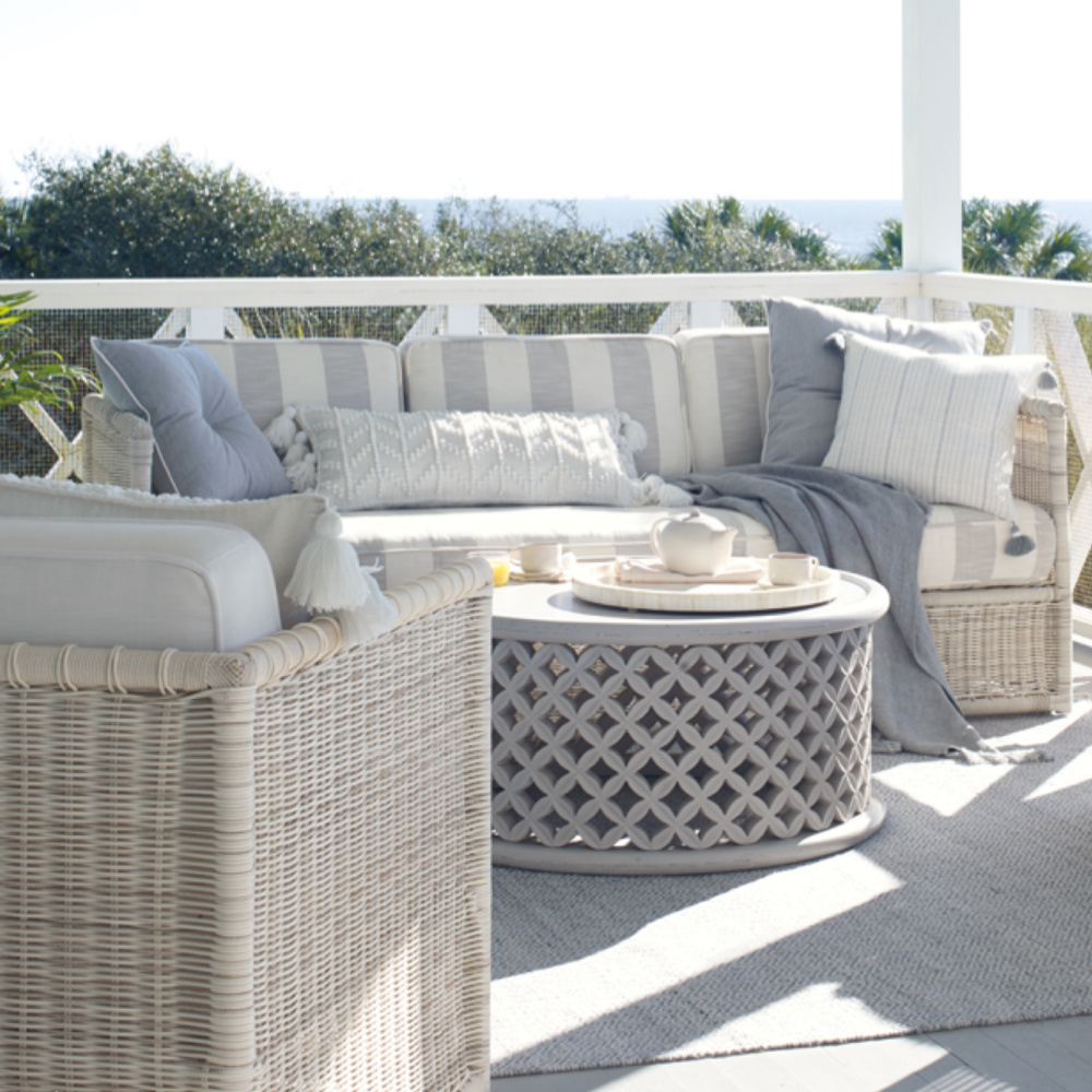 Serena & Lily Pacifica outdoor coastal style furniture with light grey on a lovely veranda.