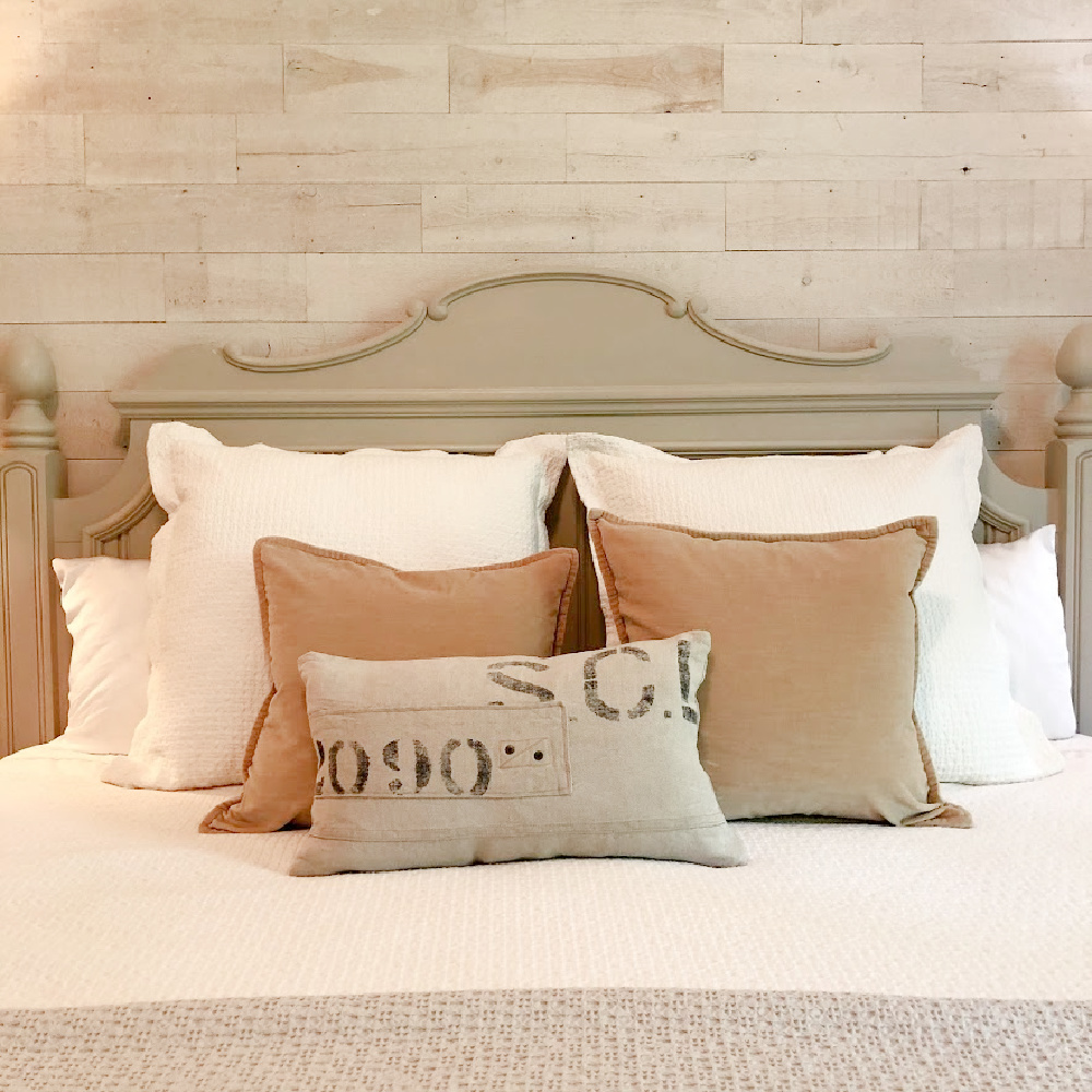 Soothing and serene neutral bedroom with European country cottage style and Stikwood planked wall - Hello Lovely. #bedroomdesign