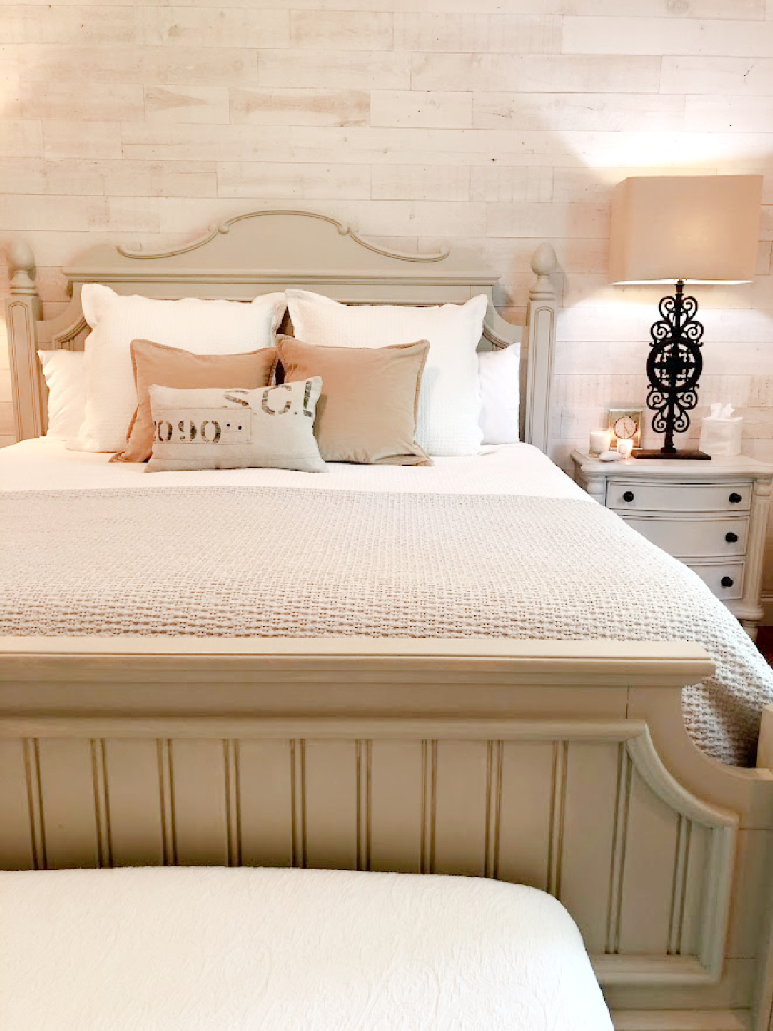 Cozy neutral Euro country cottage bedroom with pale grey, putty, gold, and white - Hello Lovely Studio. #cozyrusticbedroom #europeancountry #bedroomdecor