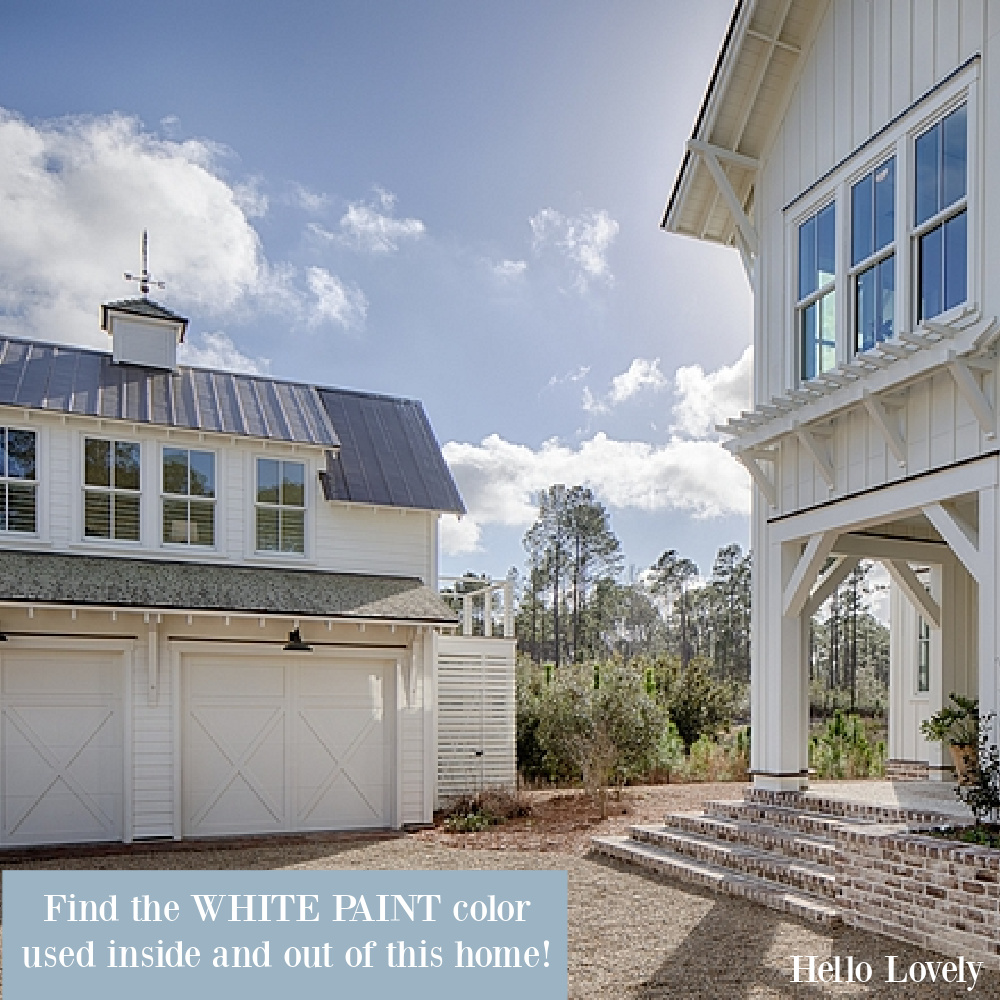 White coastal cottage in South Carolina - come find the name of the paint color used inside and out by designer Lisa Furey - Hello Lovely Studio. #coastalcottage #whitepaintcolors #exteriorpaintcolors