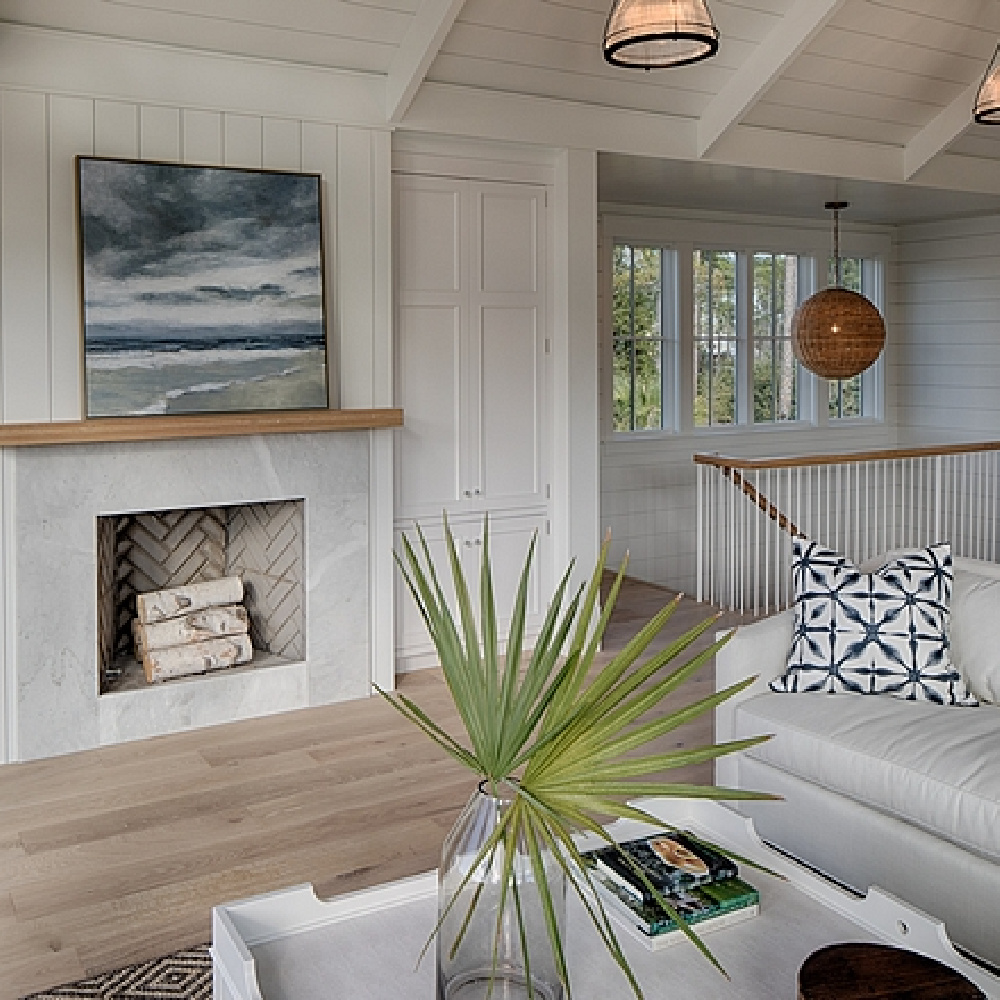Fireplace in living room. Board and batten coastal cottage in Palmetto Bluff with modern farmhouse interior design by Lisa Furey.