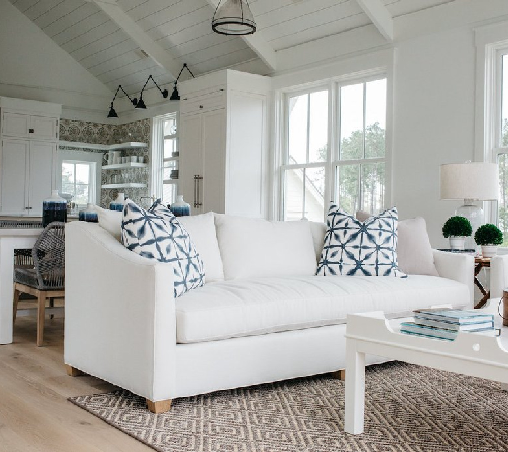 White great room in a board and batten coastal cottage in Palmetto Bluff with modern farmhouse interior design by Lisa Furey.