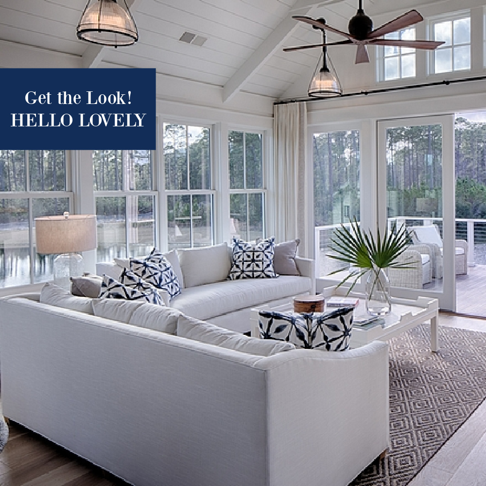 White coastal cottage great room with indigo blue accents - Lisa Furey Interiors - come find the shopping resources to get the look. #coastalcottage #getthelook #greatroom