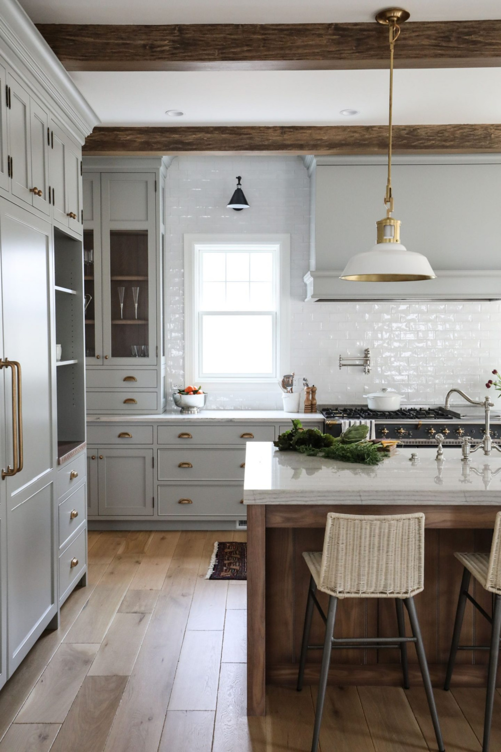 Lamp Room Gray (FB) painted cabinets in a traditional kitchen with classic style and sophistication from Park & Oak. Come see inspiring photos and learn 16 simple yet sophisticated kitchen design ideas.