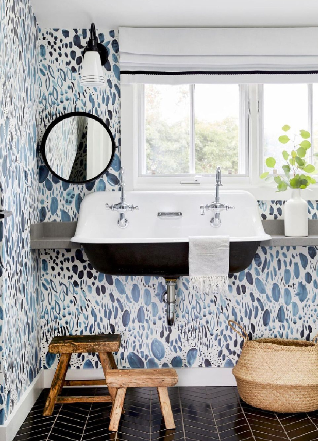 Beautiful blue bath with bold Rebecca Atwood wallpaper, trough sink, and rustic stools - Jessica Risko Smith. #modernfarmhousebathroom #bluewallpaper #bluebathroom