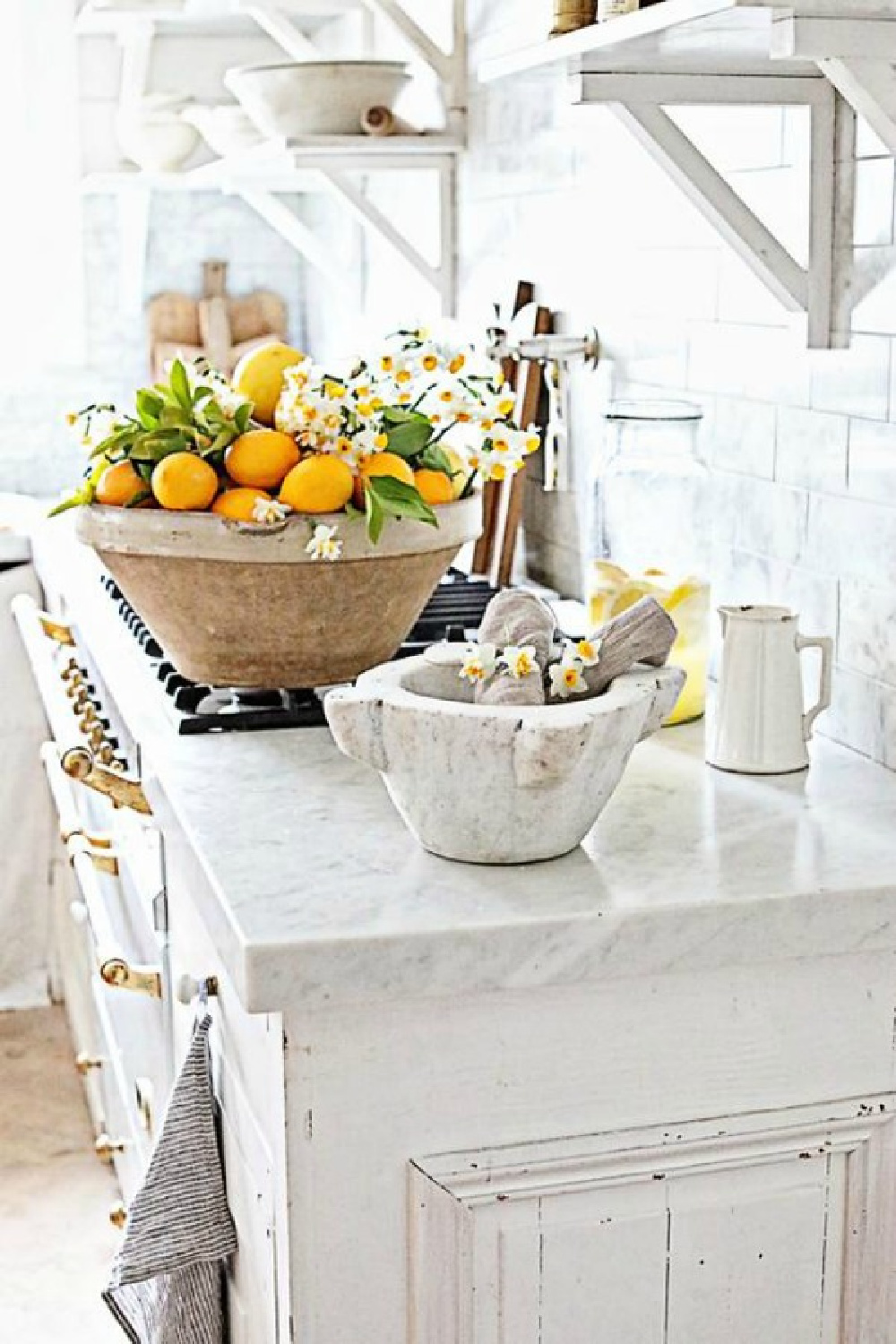 White French farmhouse kitchen with marble countertops and French range - Dreamy Whites Atelier. #whiteFrenchfarmhouse #frenchkitchens #rusticelegance