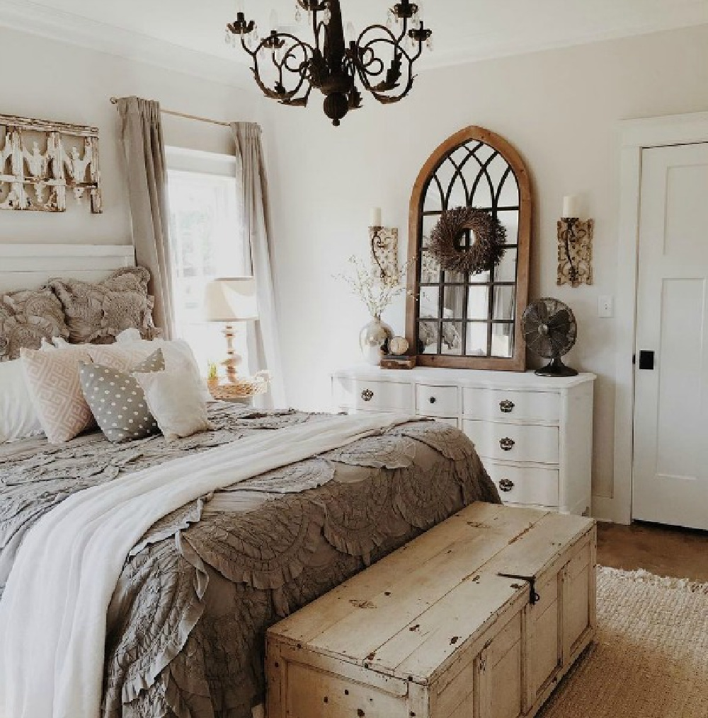 Sherwin Williams Eider White paint color on walls of bedroom designed by Brittany York. #eiderwhite #cottagebedroom #rusticdecor