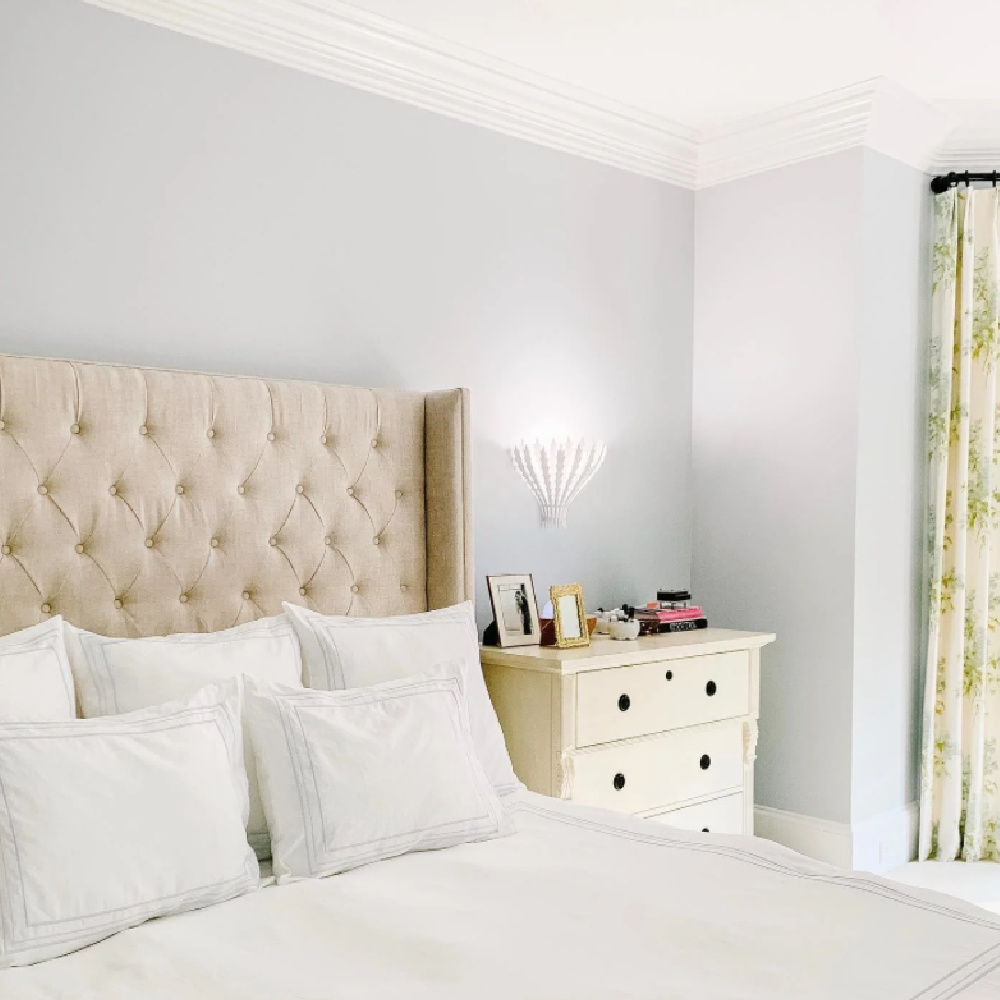 Borrowed Light paint color (Farrow & Ball) in a pretty bedroom with tufted wing headboard - Melissa Richman @embeerich. #borrowedlight #bluepaintcolors