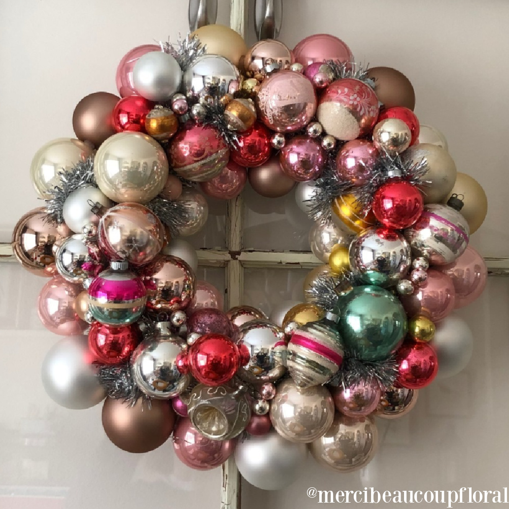 Christmas wreath with colorful glass ornaments - Merci Beacoup Floral. #christmaswreaths #vintagechristmas #ornamentwreath