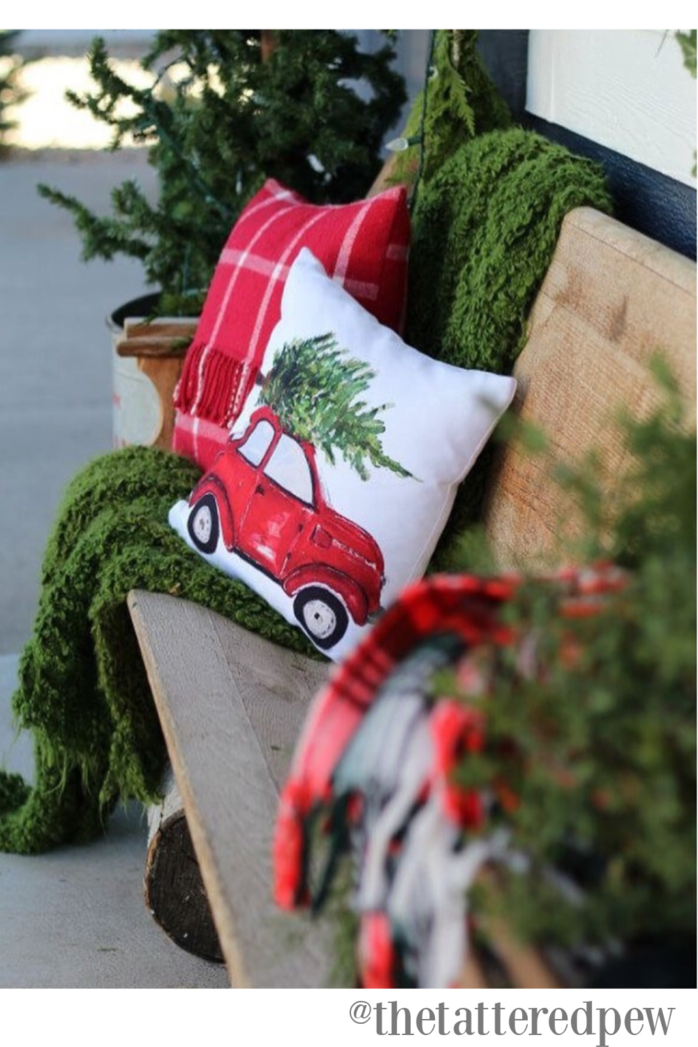 Rustic farmhouse Christmas decor with church pew and pillows - The Tattered Pew. #farmhousechristmas #countrychristmas #holidaydecor