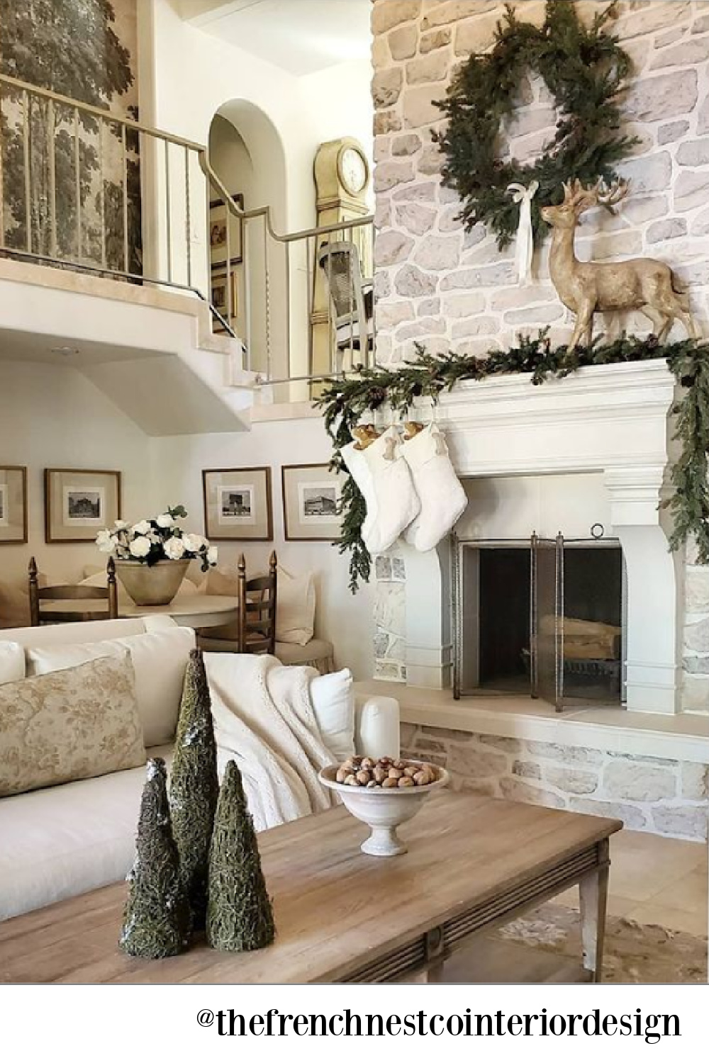 French country Christmas decor in a lovely living room with neutral palette and white - The French Nest Co Interior Design. #whitechristmasdecor #frenchcountrychristmas