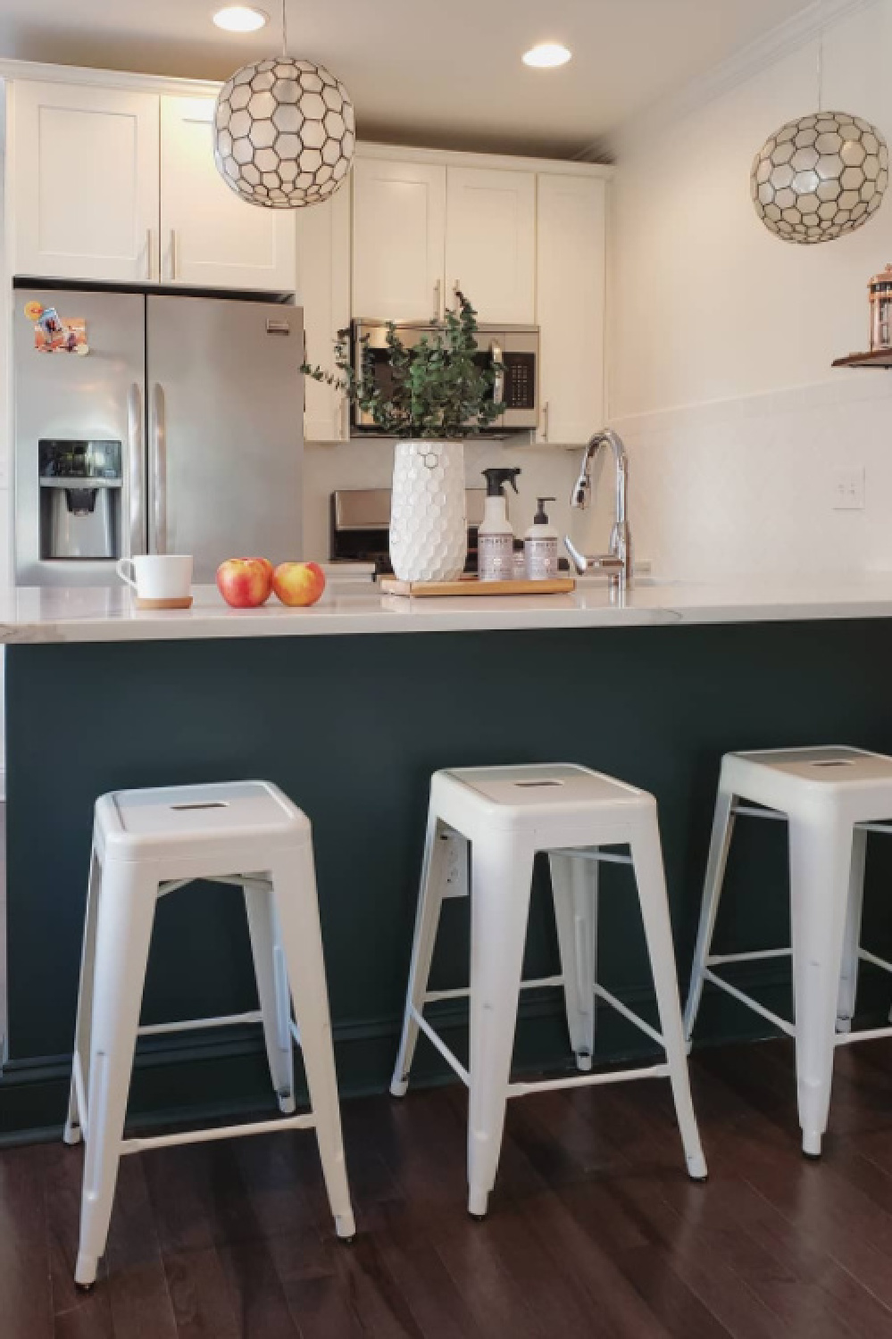 Tarrytown Green (Benjamin Moore) paint color on a breakfast bar in a kitchen - @casio_barnes. #benjaminmooretarrytowngreen #greenpaintcolors