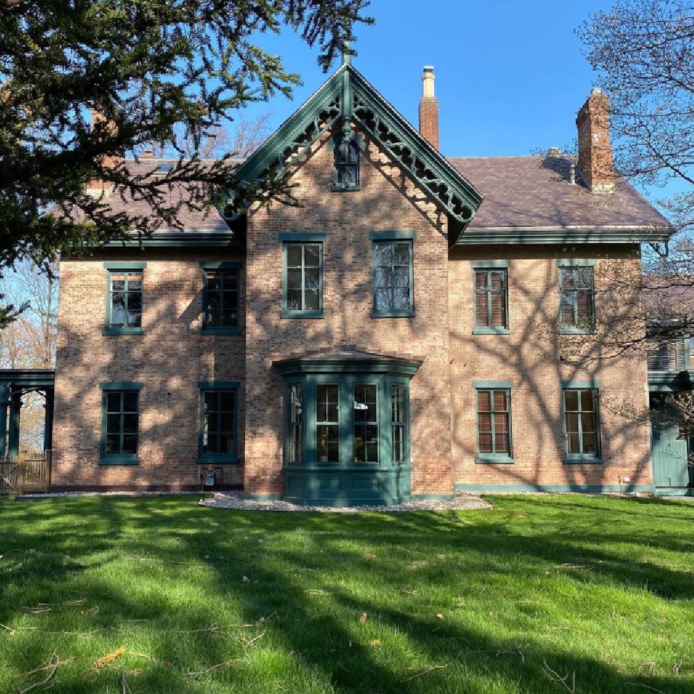 Tarrytown Green paint color (Benjamin Moore) on trim of a beautiful historic rick home - @rosshand1859. #tarrytowngreen #benjaminmooretarrytowngreen #paintcolors