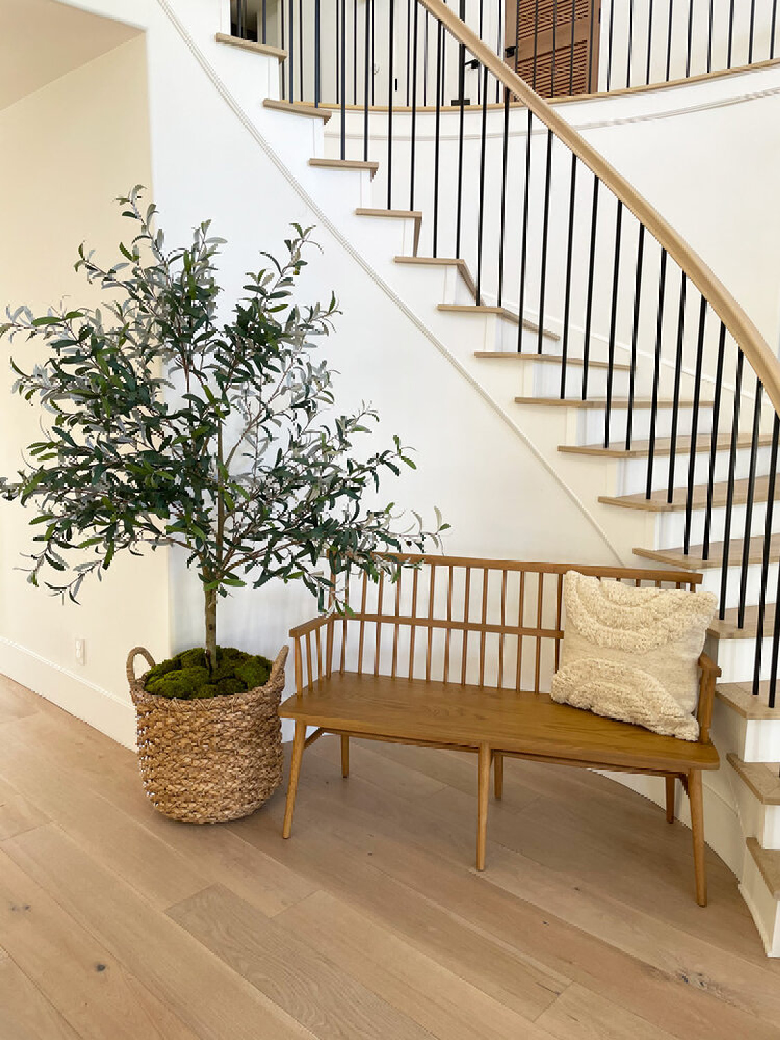 Neutral, Modern French style staircase and entry with bench and potted tree - design by AR Interiors (Anna Rosemann).