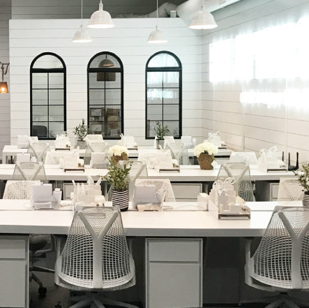 Black and white industrial chic style inside Grayson headquarters in LA - white brick, black trim, lofty ceilings, shiplap, and design with AR Interiors (Anna Rosemann).