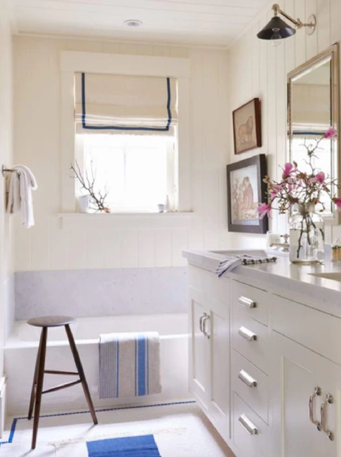 Coastal classic American bathroom with blue accents and creamy walls - Mark Sikes, author of MORE BEAUTIFUL (Rizzoli, 2020) with photography by Amy Neunsinger.