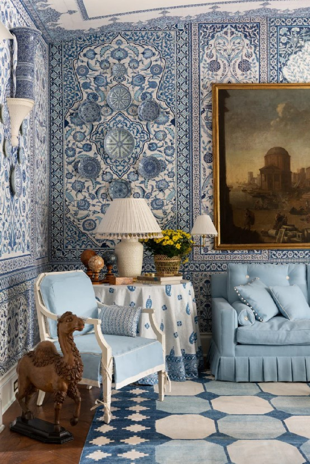 Fanciful blue wallcovering in a classic American living room with interior design by Mark Sikes, author of MORE BEAUTIFUL (Rizzoli, 2020) with photography by Amy Neunsinger.