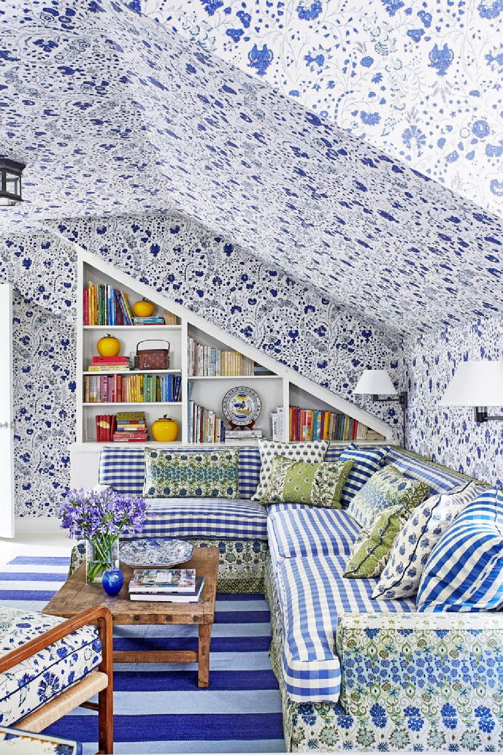 Beautiful mixed royal blue patterns of wallpaper and upholstery in a charming traditional space - design by Mark Sikes.