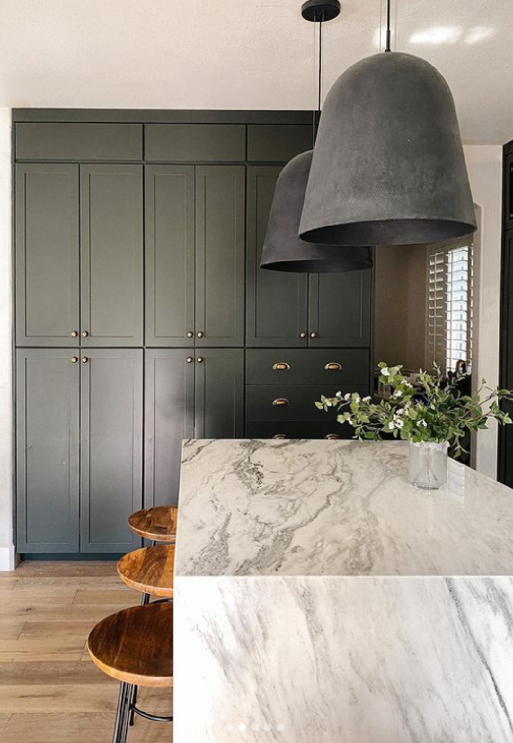 Customized cabinet fronts from NIEU (Angela Rose Slim Shaker Detail in Dream Dusk) in a luxurious kitchen with marble island and moody dark color. #refacedcabinets #customcabinetfronts #nieu