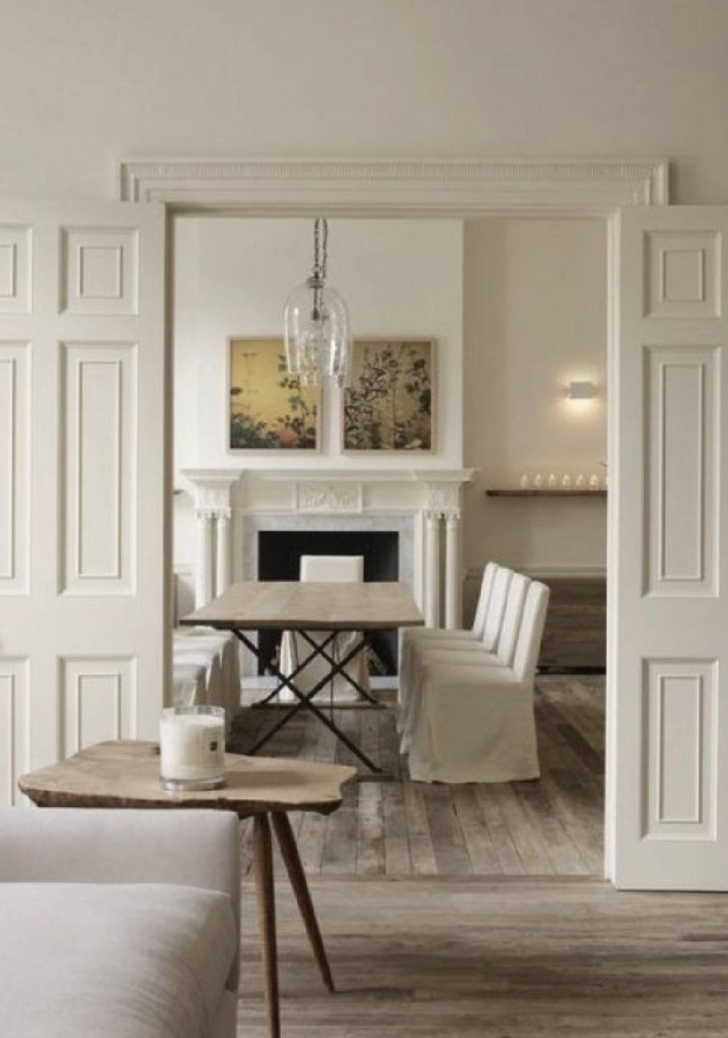 Rose Uniacke designed room in Jo Malone London headquarters with rustic wood floors and neutral classic palette.