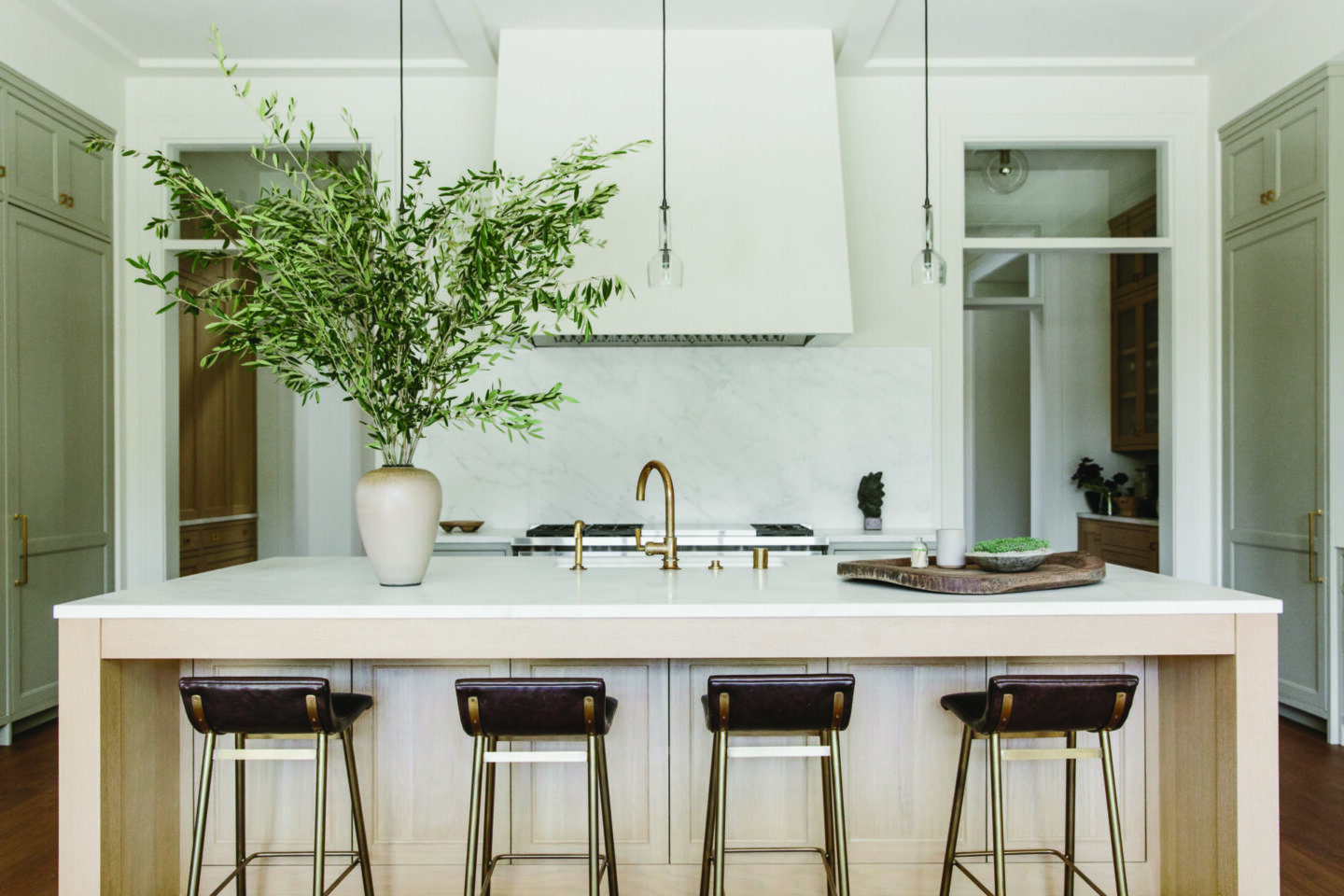 Modern and spare, this Sheila Bouttier designed modern natural kitchen has all the California calm vibes.