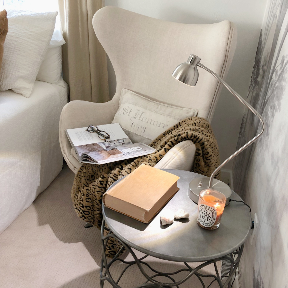 Cozy Copenhagen egg chair with Belgian linen upholstery in a bedroom with grisaille wall mural - Hello Lovely Studio.