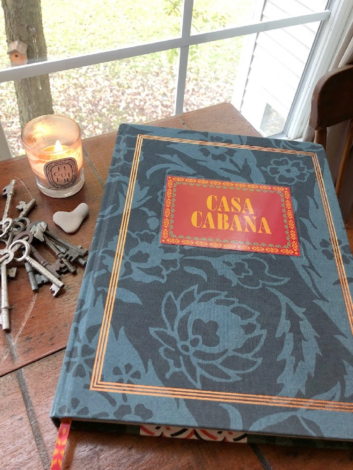 CASA CABANA by Martina Mondadori on my desk with candle and keys - Hello Lovely Studio.