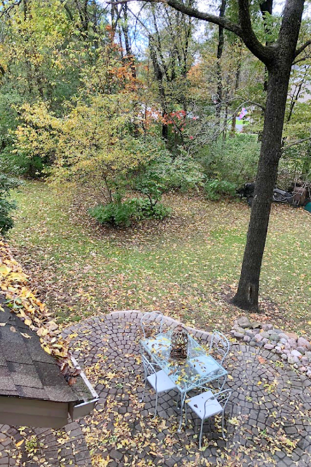 Yellow fallen leaves on my patio with vintage dining set - Hello Lovely Studio.