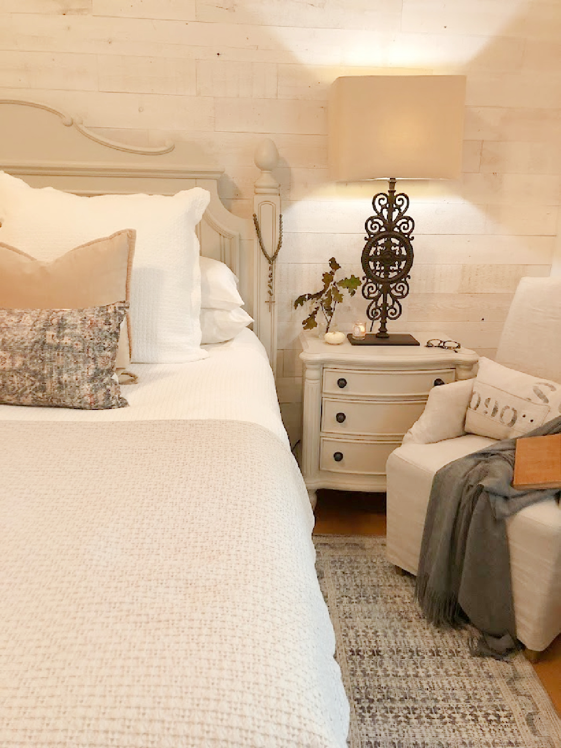 Fall bedroom with blue Montara pillow and Zuma Ocean rug (Amber Lewis x Loloi) by Hello Lovely Studio.