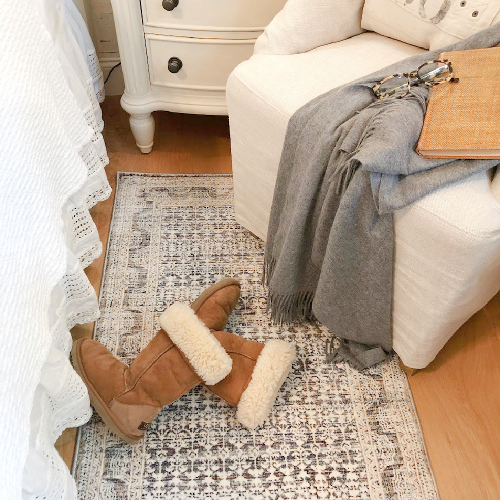 Ugg tall boots in Hello Lovely's fall bedroom with Zuma Zum ocean area rug (Amber Lewis x Loloi).