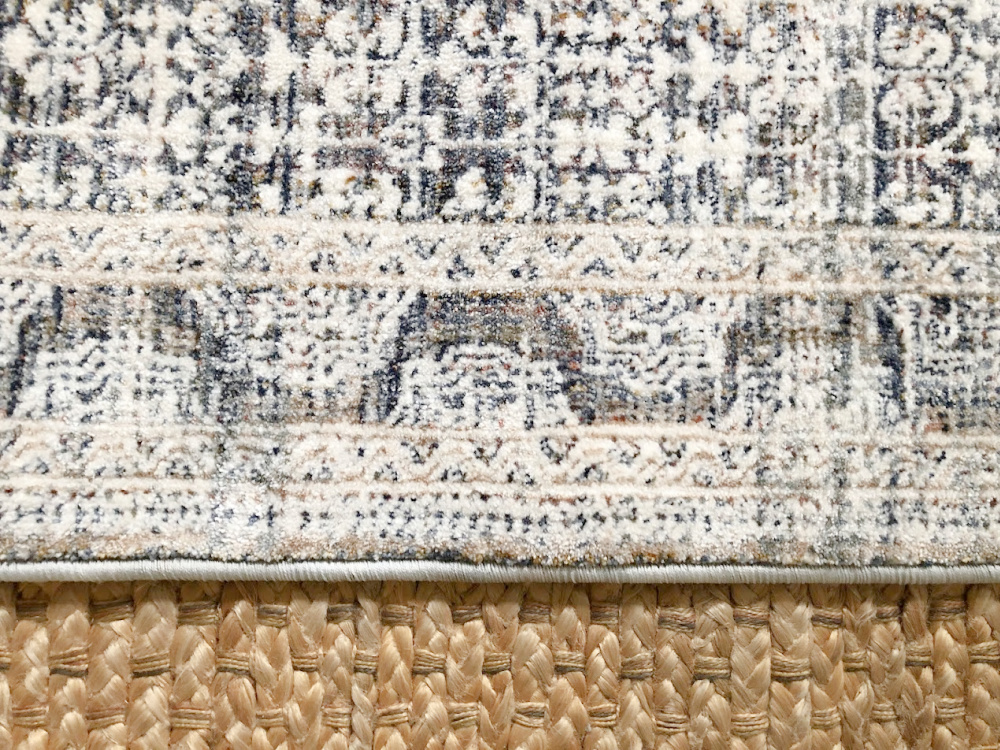 Amber Lewis x Loloi Zuma Zum Ocean Area Rug layered over a jute rug - Hello Lovely Studio.