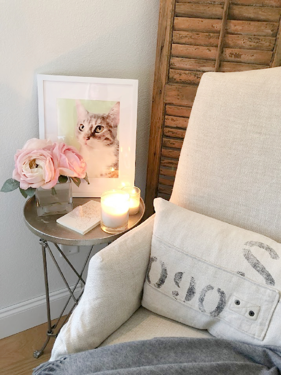 Cat watercolor custom pet portrait from minted in white frame in a cozy corner of our bedroom - Hello Lovely. #catwatercolor #petpainting #catpainting