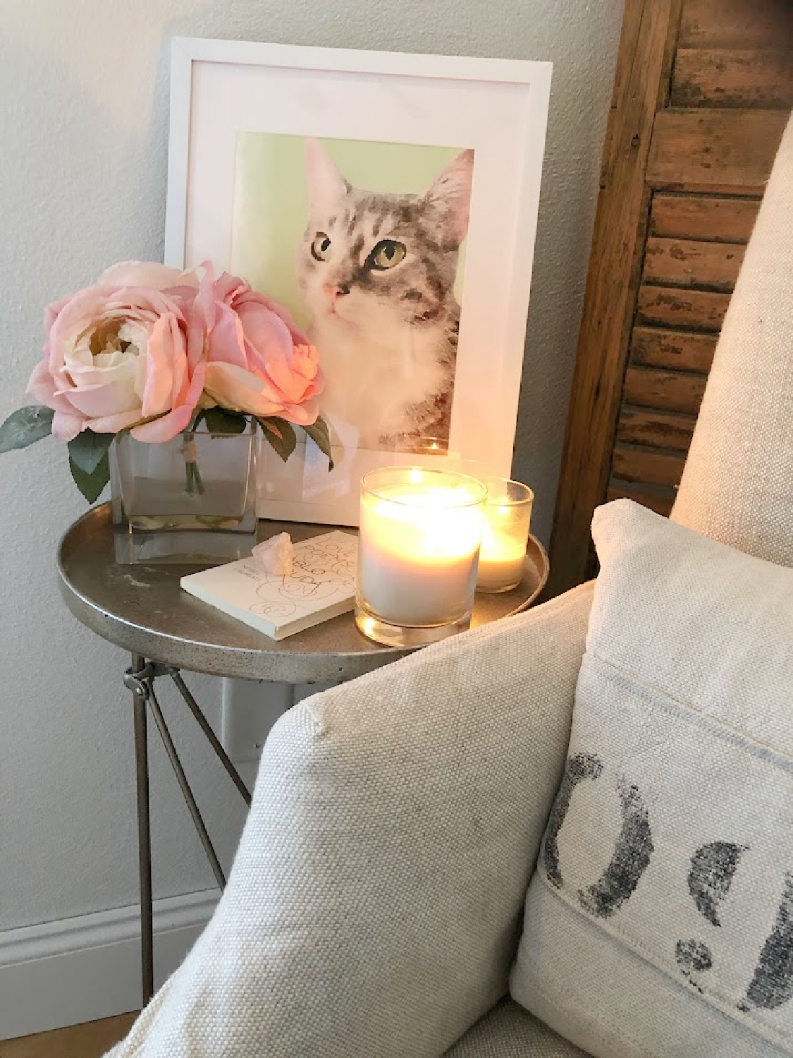 Cat watercolor custom pet portrait from minted in white frame in a cozy corner of our bedroom - Hello Lovely. #catwatercolor #petpainting #catpainting