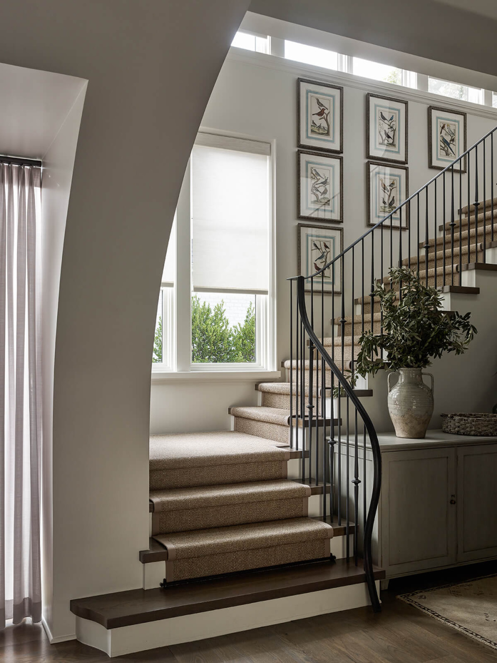 Staircase with a freshened traditional feel and modern iron railings - Pursley Dixon Architecture.