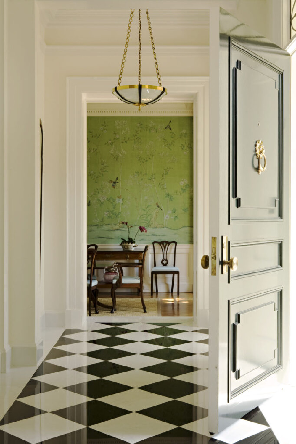 Green deGournay wallpaper in a Thomas Proctor Hollywood home with checkered floor in the entry -  interior design by Elizabeth Dinkel. #greeninterior #degournaywallpaper #entry