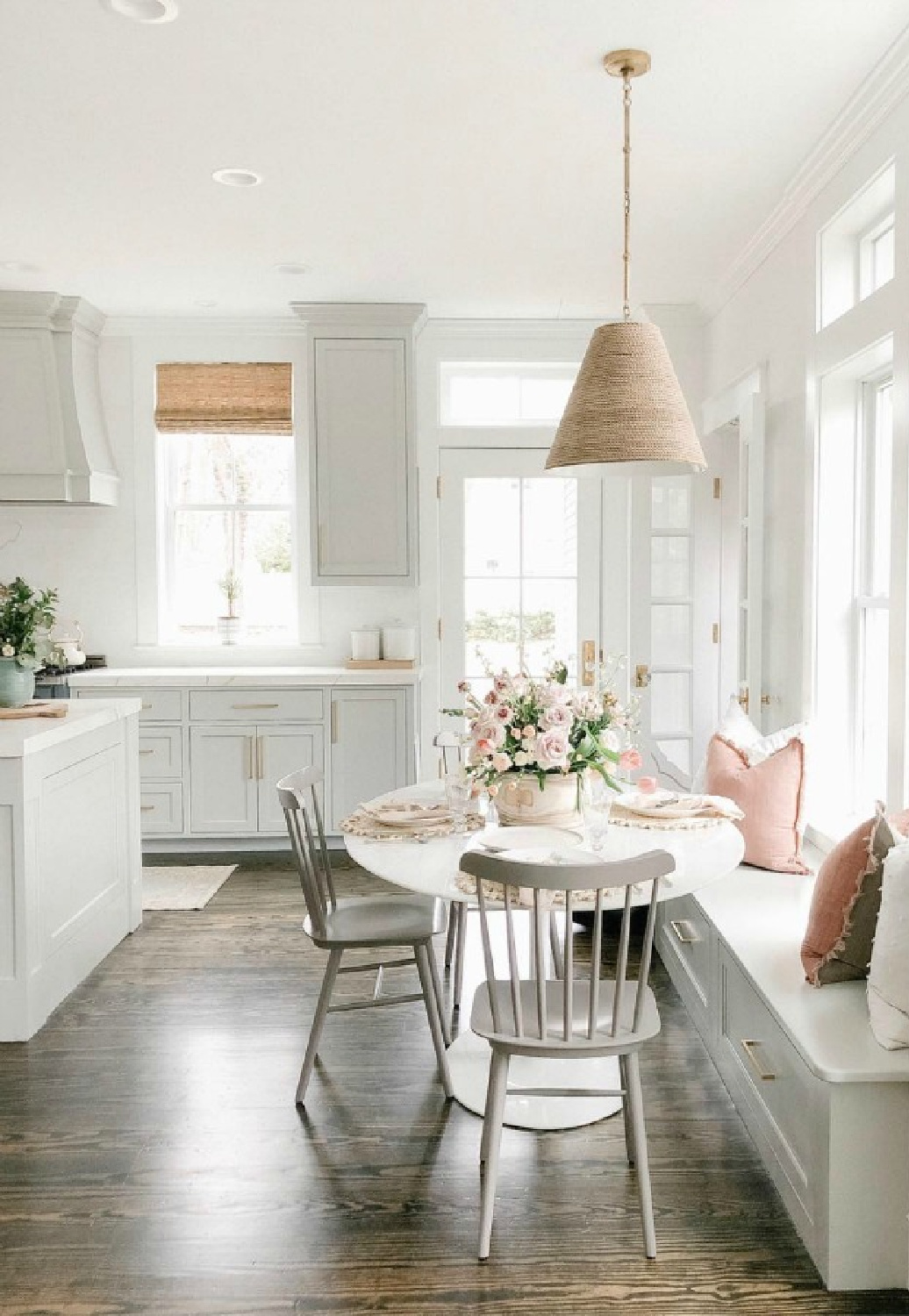 Grey and white serene kitchen with breakfast nook and window seat - Finding Lovely. #greykitchen #modernfarmhouse #kitchendesign