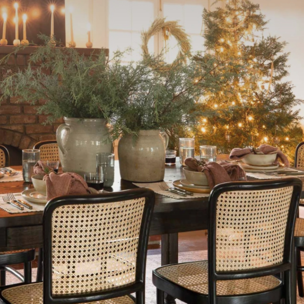 Holiday decor in a dining room with fireplace - Shoppe Amber Interiors. #holidaydecorating #diningroom #californiacool