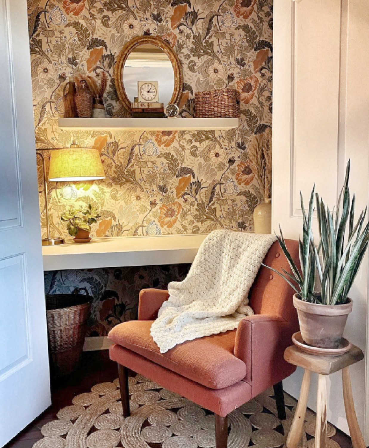 Whimsical earth toned floral wallpaper lining a closet converted to a mini home office - @stac.2me