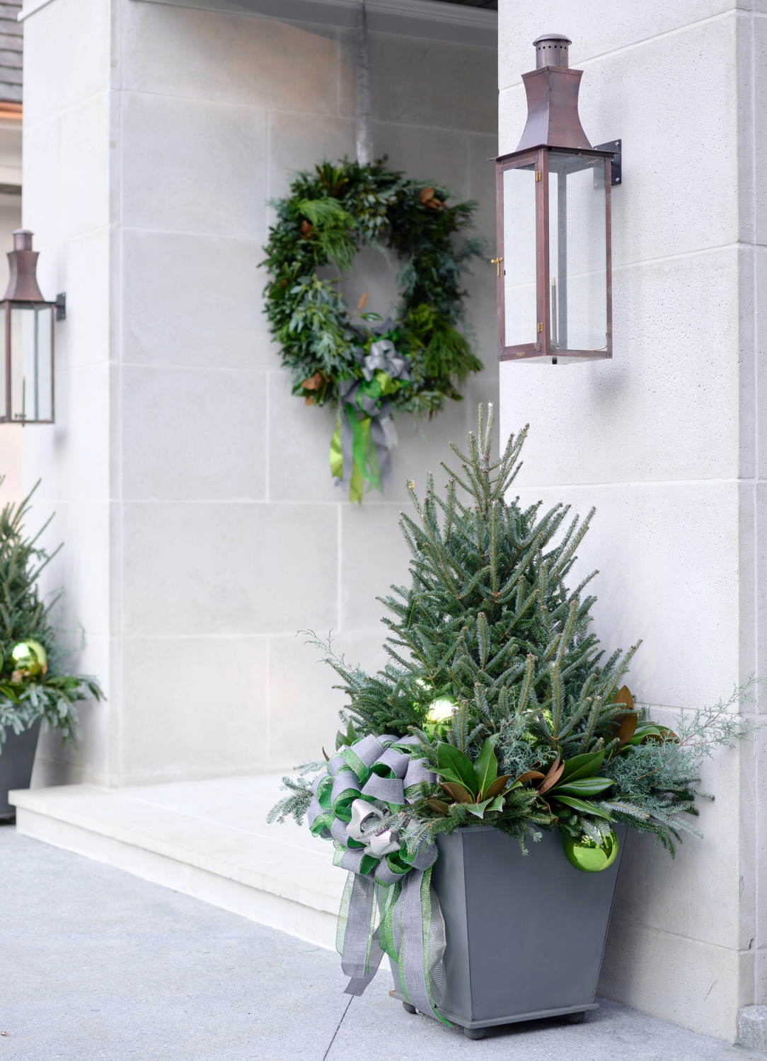 Elegant Christmas decor planters at Atlanta Home for Holidays Designer Showhouse 2021 - Boxwoods Gardens & Gifts. #outdoorchristmasdecor