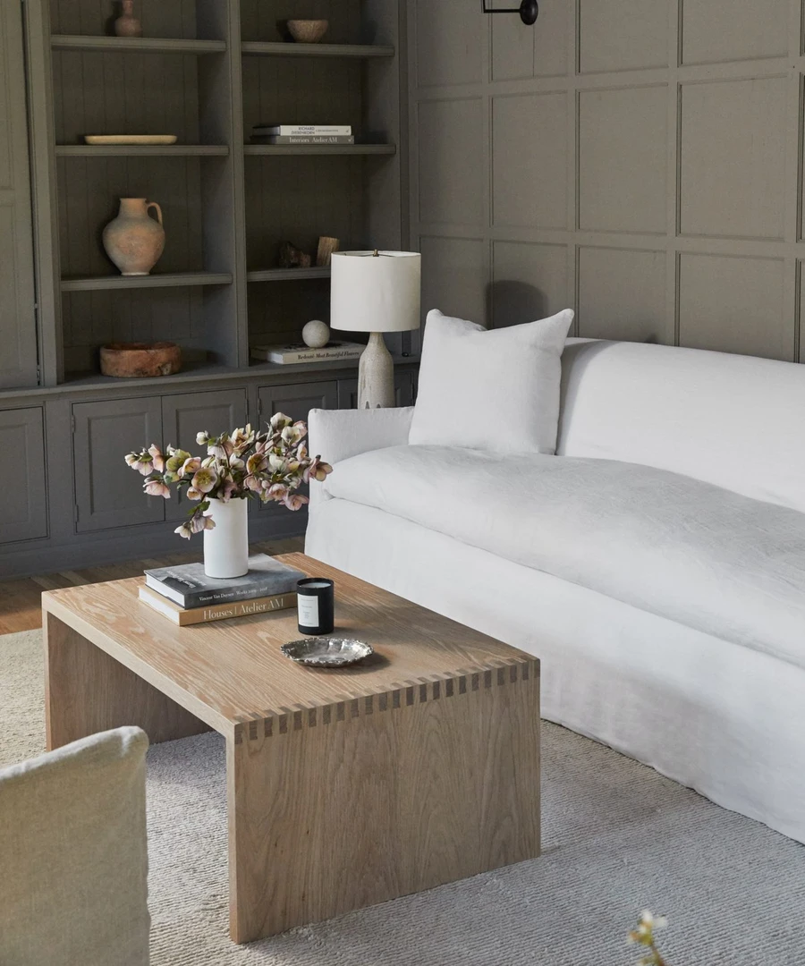 Miramar white linen sofa in a gorgeous room with paneled, warm green-gray moody walls - Jenni Kayne